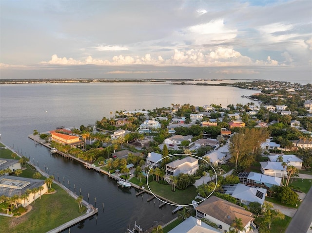 bird's eye view with a residential view and a water view