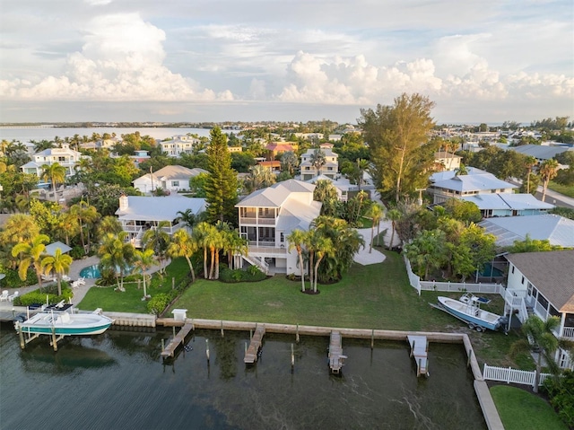 bird's eye view with a residential view and a water view