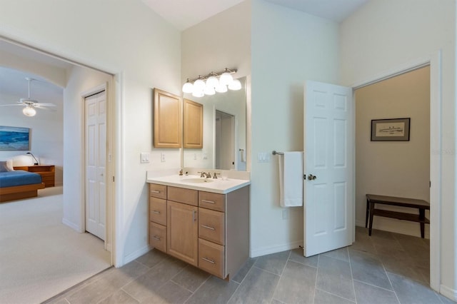 bathroom featuring baseboards, ceiling fan, vanity, and tile patterned flooring