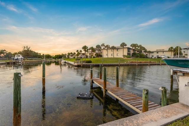 dock area with a water view and a residential view