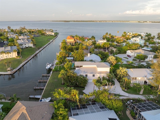 drone / aerial view featuring a residential view and a water view