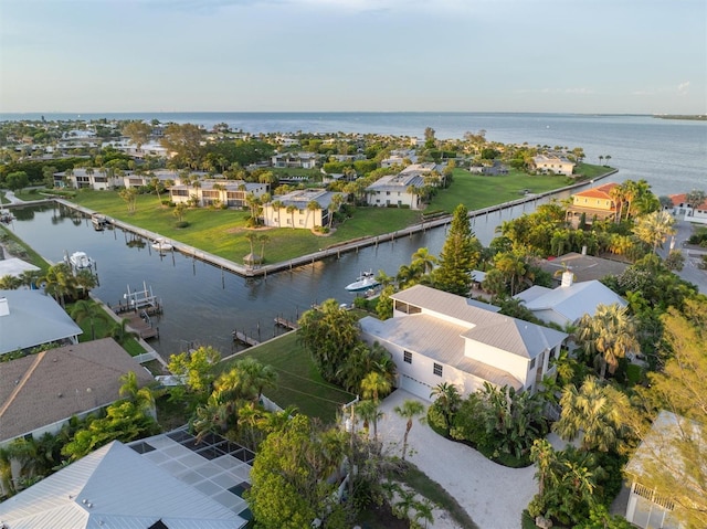 birds eye view of property with a residential view and a water view