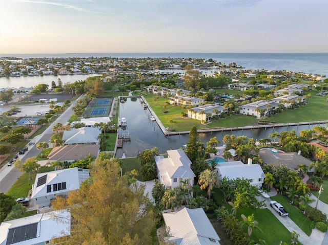 bird's eye view with a residential view and a water view