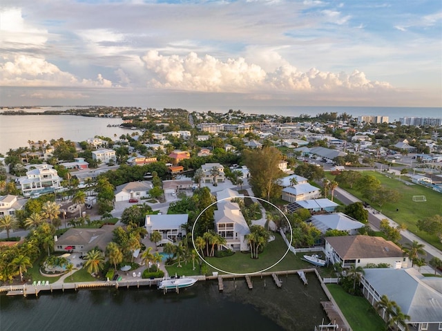 aerial view featuring a residential view and a water view