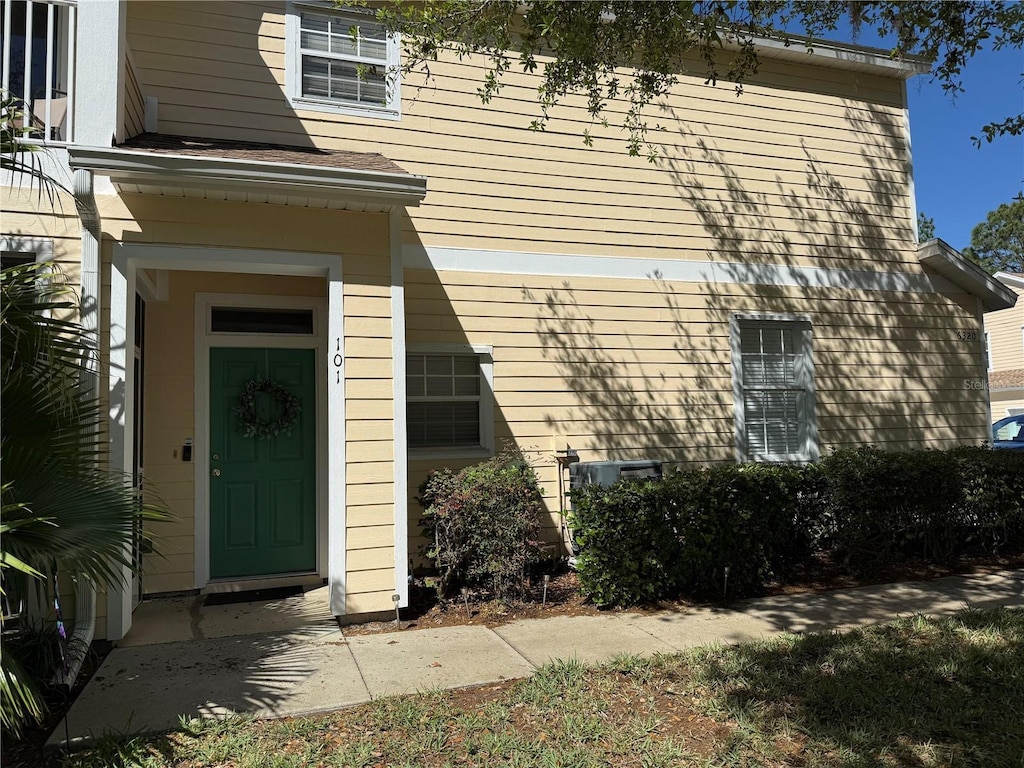 view of exterior entry featuring central AC