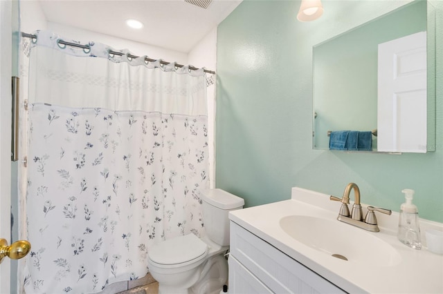 bathroom featuring a shower with shower curtain, toilet, and vanity