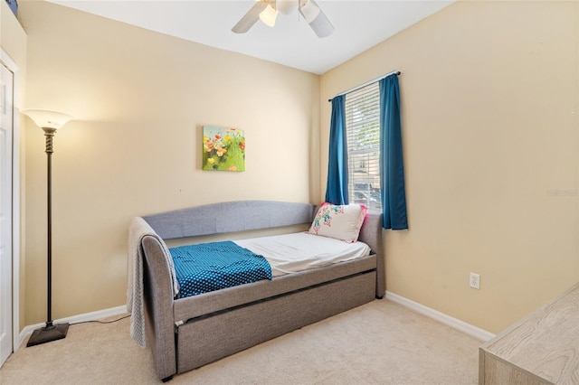 bedroom featuring carpet, baseboards, and ceiling fan