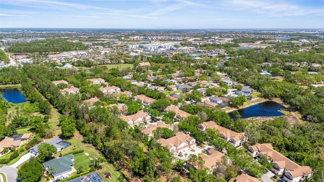 bird's eye view with a residential view and a water view
