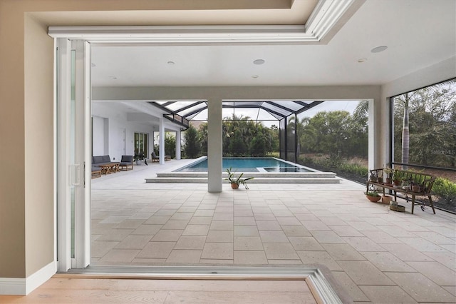 pool featuring a lanai and a patio area