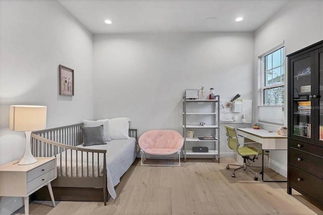 bedroom featuring recessed lighting, baseboards, and wood finished floors