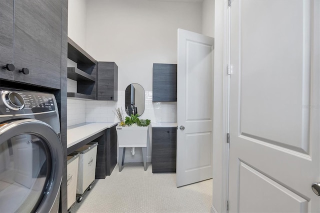 washroom with washer / dryer and laundry area