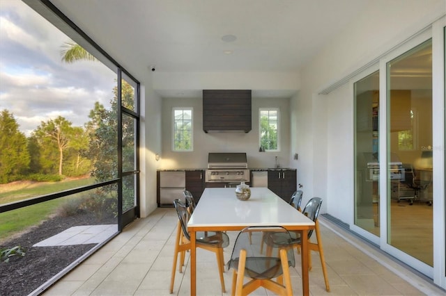 sunroom with a sink