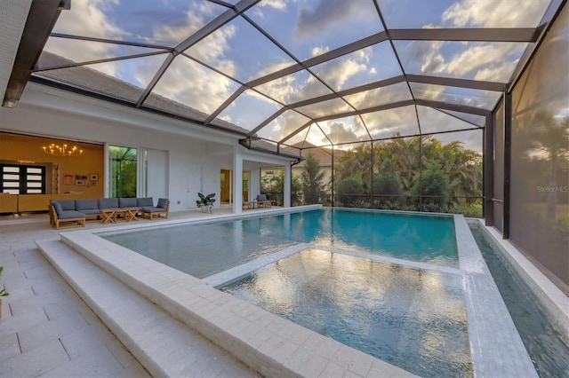 pool featuring outdoor lounge area and a patio area