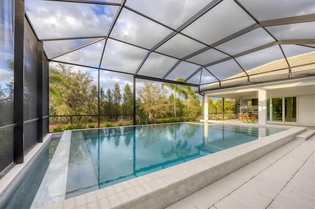 outdoor pool with a lanai and a patio