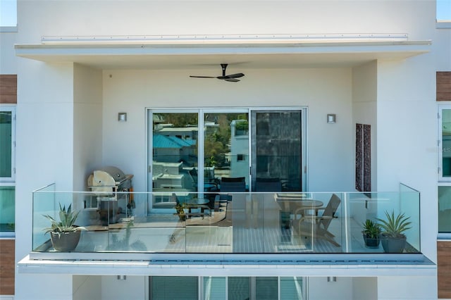 view of patio featuring ceiling fan and a grill