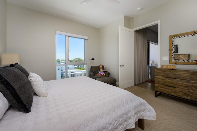 bedroom with a ceiling fan and carpet floors