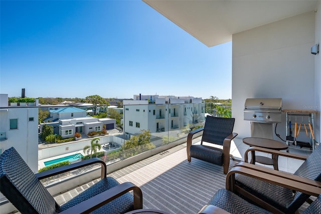 balcony with area for grilling and a residential view