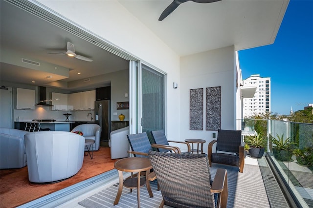 balcony featuring a sink, visible vents, and ceiling fan