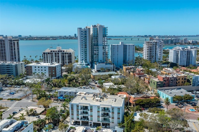 birds eye view of property with a city view and a water view