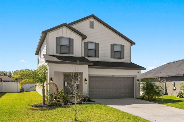 view of front of property with board and batten siding, a front lawn, fence, concrete driveway, and a garage