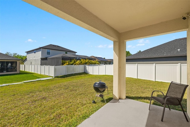 view of yard with a fenced backyard and a patio