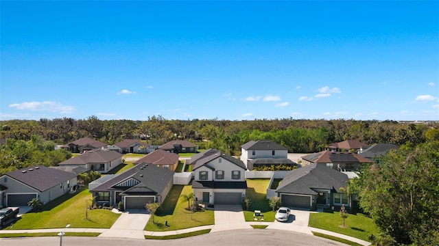 aerial view featuring a view of trees and a residential view