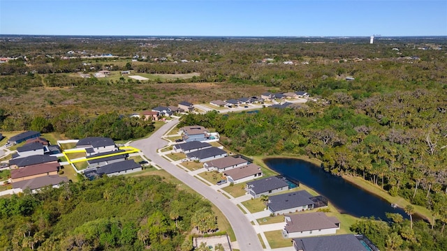 drone / aerial view featuring a residential view and a water view