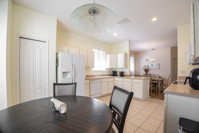 dining space with light tile patterned floors, recessed lighting, and visible vents