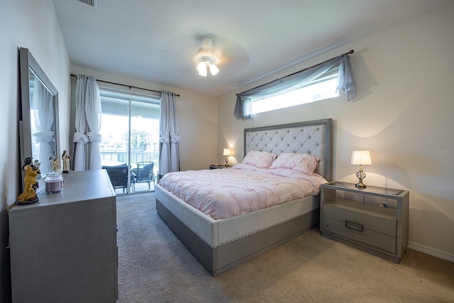 bedroom featuring access to outside, multiple windows, light colored carpet, and baseboards