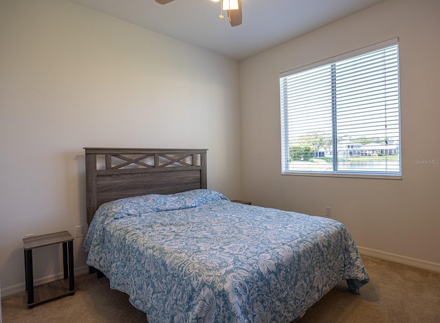 bedroom featuring baseboards, carpet, and a ceiling fan