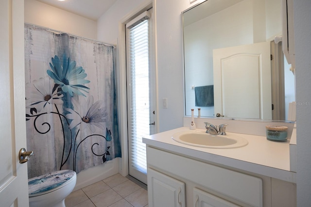 full bathroom featuring tile patterned flooring, toilet, and vanity