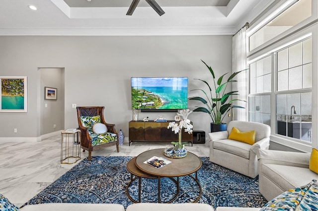 living room featuring crown molding, recessed lighting, baseboards, and marble finish floor