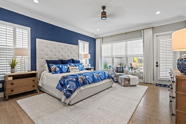 bedroom featuring baseboards, wallpapered walls, recessed lighting, hardwood / wood-style flooring, and crown molding