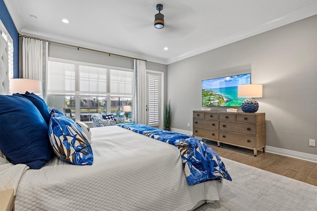 bedroom featuring recessed lighting, ornamental molding, baseboards, and wood finished floors