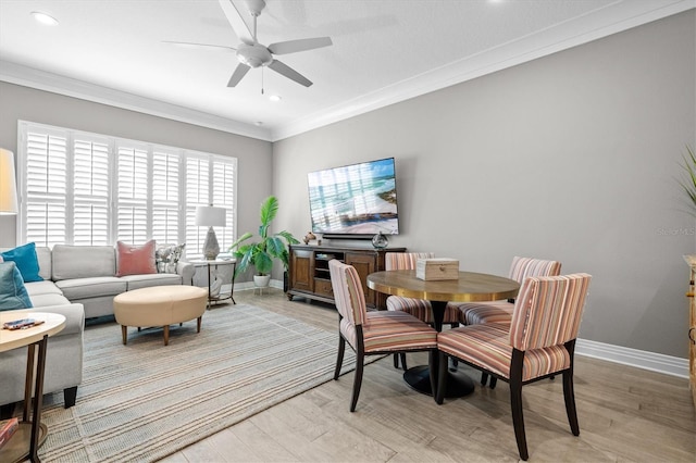 dining area featuring a ceiling fan, baseboards, recessed lighting, light wood-style floors, and crown molding