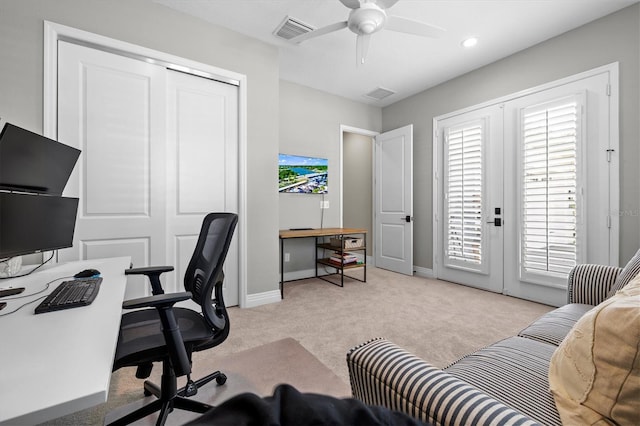 home office with baseboards, carpet, visible vents, and ceiling fan