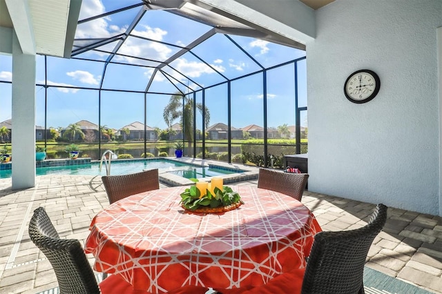 view of patio with an outdoor pool, glass enclosure, and an in ground hot tub