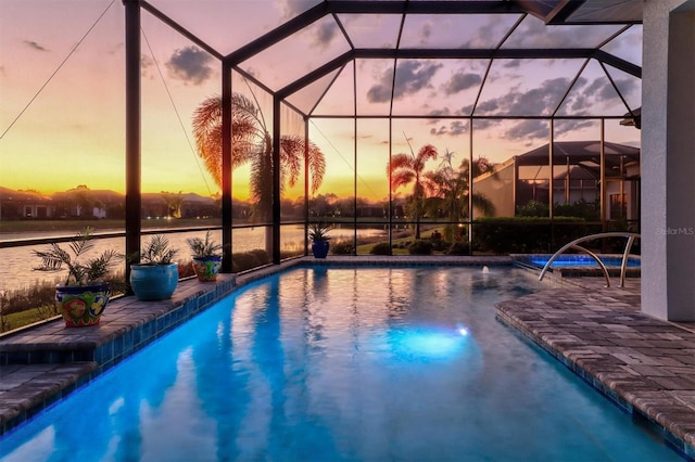 pool with glass enclosure and a patio