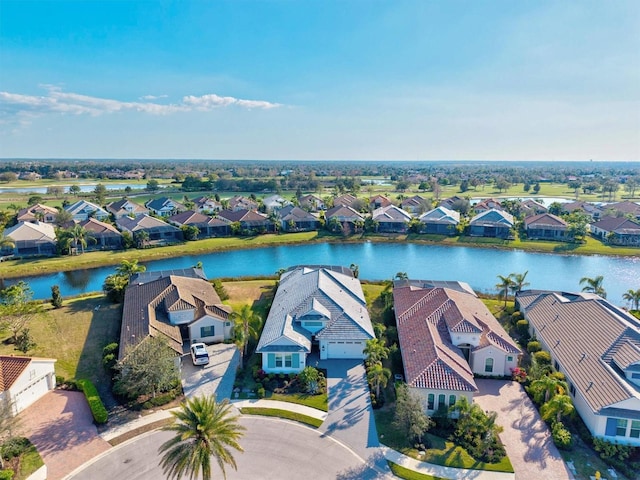 aerial view featuring a residential view and a water view