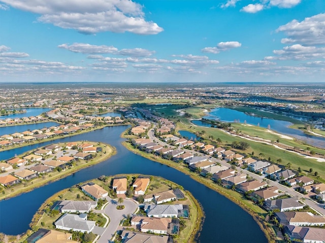 bird's eye view with a residential view and a water view