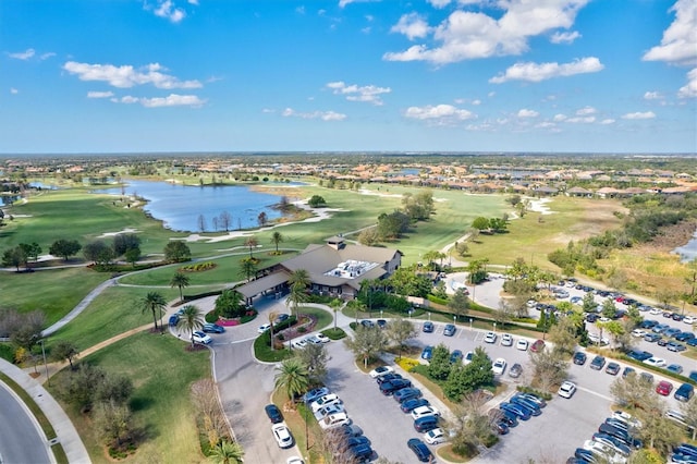 drone / aerial view featuring a water view and view of golf course