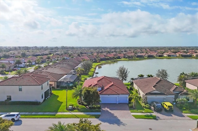 bird's eye view with a residential view and a water view