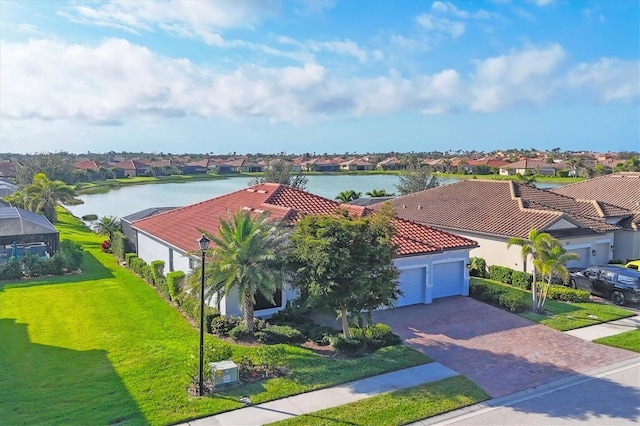 aerial view with a residential view and a water view