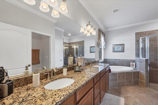 full bathroom featuring visible vents, crown molding, a stall shower, a bath, and a sink