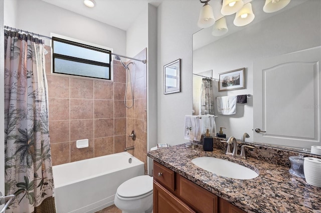 bathroom featuring vanity, toilet, and shower / bath combo with shower curtain