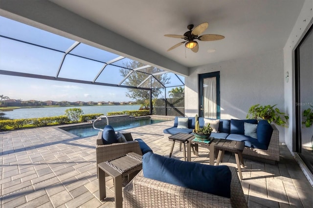 view of patio / terrace with a water view, a lanai, an outdoor hangout area, an outdoor pool, and a ceiling fan