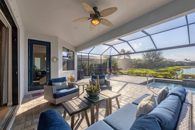 view of patio with an outdoor living space, area for grilling, an outdoor pool, ceiling fan, and a lanai