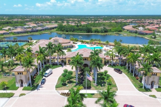 drone / aerial view featuring a residential view and a water view