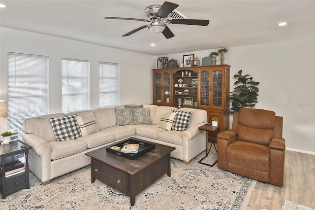 living room with light wood-style flooring, recessed lighting, baseboards, and ceiling fan