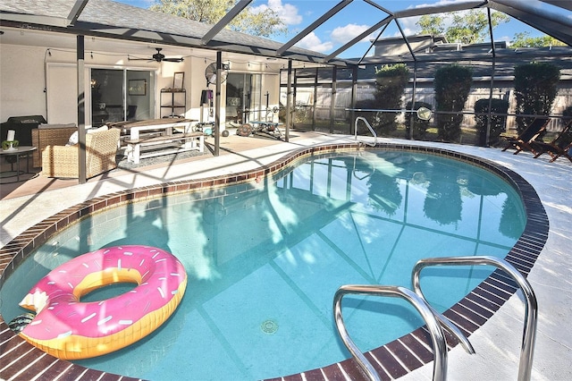 pool featuring ceiling fan, a patio, and a lanai